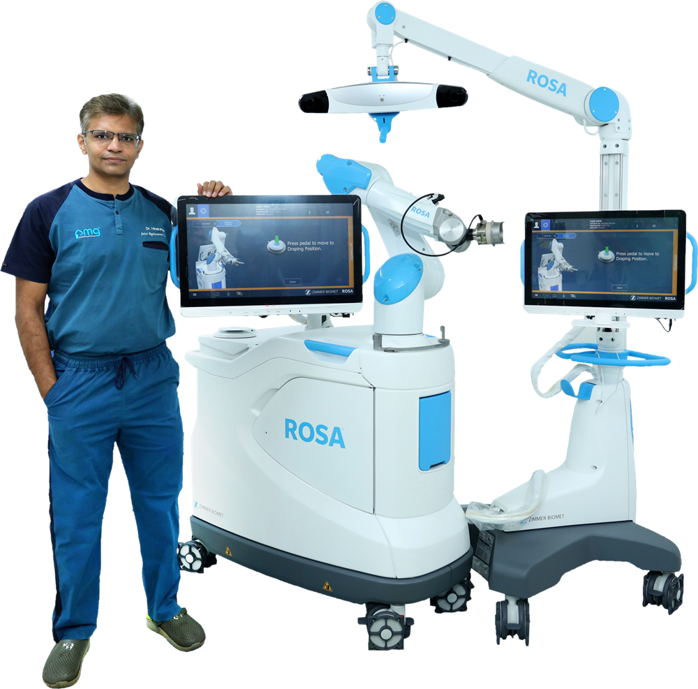 Dr. Hiren Patel with the ROSA robotic system at PMG Hospital, Ahmedabad