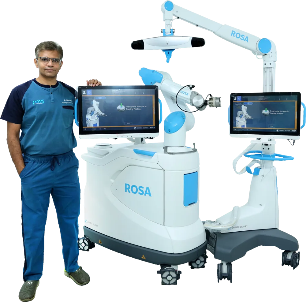 Dr. Hiren Patel with the ROSA robotic system at PMG Hospital, Ahmedabad